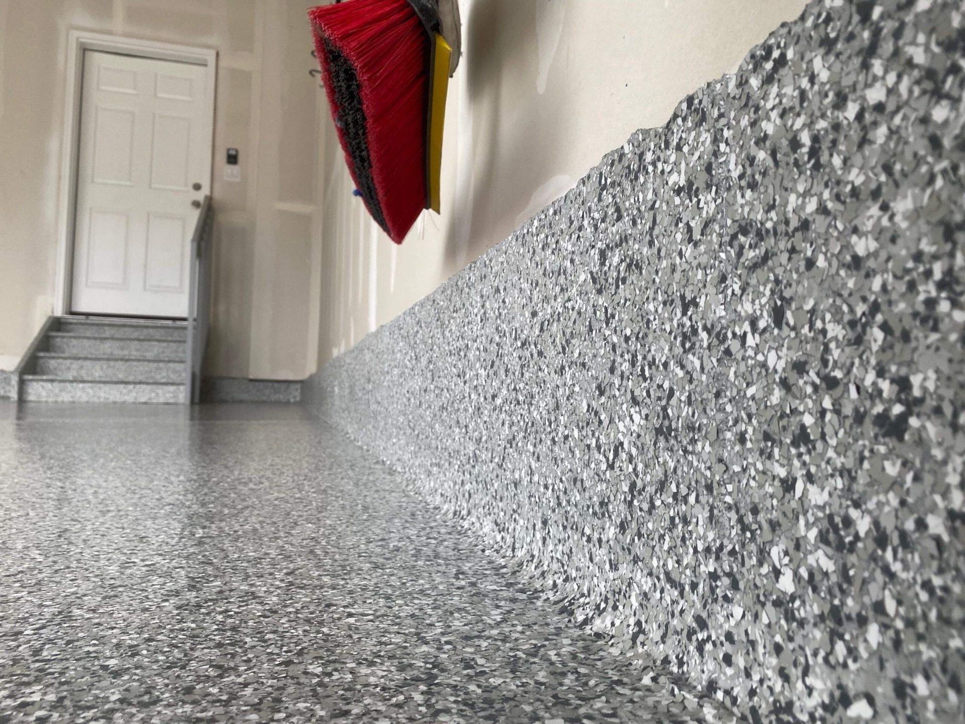Epoxy flake floor with coated stem wall and stairs