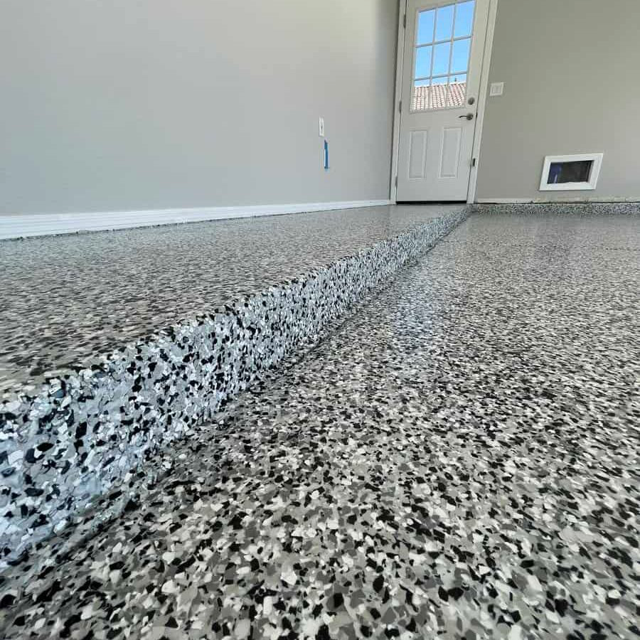 Polyaspartic flake coating wrapped over a garage step